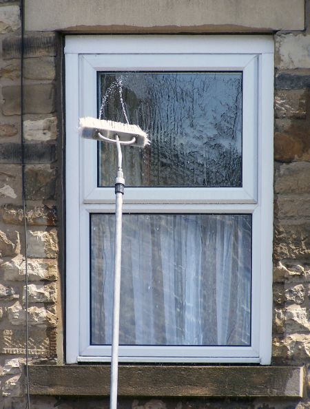 Crystal-Clear Views: Window Washing Tips Between Professional Visits